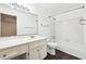 Clean bathroom, white tile, and dark hardwood floor at 2408 Country Park Se Dr, Smyrna, GA 30080