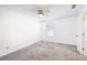 Spacious bedroom with ceiling fan and grey carpet at 2408 Country Park Se Dr, Smyrna, GA 30080