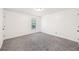 Spacious bedroom with gray carpeting and neutral walls at 2408 Country Park Se Dr, Smyrna, GA 30080