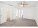 Bedroom with ceiling fan, carpet, and ample closet space at 2408 Country Park Se Dr, Smyrna, GA 30080