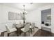 Formal dining room with chandelier and hardwood floors at 2408 Country Park Se Dr, Smyrna, GA 30080