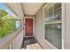 Red front door entry with wooden deck and railing at 2408 Country Park Se Dr, Smyrna, GA 30080