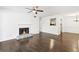 Living room with dark hardwood floors, fireplace, and view to kitchen at 2408 Country Park Se Dr, Smyrna, GA 30080