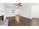 Living room with dark hardwood floors, fireplace, and access to hallway at 2408 Country Park Se Dr, Smyrna, GA 30080