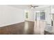 Living room with dark hardwood floors, fireplace, and sunroom access at 2408 Country Park Se Dr, Smyrna, GA 30080