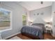 Bright bedroom with hardwood floors, queen bed, and ample natural light at 490 Rockwell Sw St, Atlanta, GA 30310