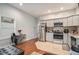 Modern kitchen with gray cabinets and stainless steel appliances at 490 Rockwell Sw St, Atlanta, GA 30310