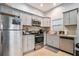 Modern kitchen with gray cabinets and stainless steel appliances at 490 Rockwell Sw St, Atlanta, GA 30310