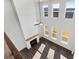 Bright living room features a tall shiplap wall, a fireplace, and many windows for natural light at 6935 Melody Dr, Buford, GA 30518