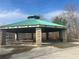 The Connie Wiggins Pavilion features a large covered area with picnic tables and brick support columns at 6935 Melody Dr, Buford, GA 30518