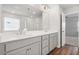 Bright bathroom with a double sink vanity, large mirror and separate shower at 6935 Melody Ridge Rd, Buford, GA 30518