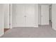 Spacious bedroom with neutral carpeting and double door closet at 6939 Melody Dr, Buford, GA 30518