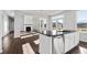 Modern kitchen with white cabinets and a large island at 6939 Melody Dr, Buford, GA 30518