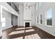 Spacious living room featuring a fireplace and high ceilings at 6935 Melody Dr, Buford, GA 30518