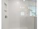 Clean shower with white tile and glass enclosure at 6939 Melody Dr, Buford, GA 30518