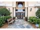 Community entrance with bench and landscaping at 3777 Peachtree Ne Rd # 713, Atlanta, GA 30319