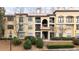 Attractive three-story building with terracotta accents and landscaping at 3777 Peachtree Ne Rd # 713, Atlanta, GA 30319