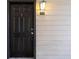 Condo exterior with black front door and light colored siding at 3777 Peachtree Ne Rd # 713, Atlanta, GA 30319