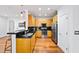 Modern kitchen with stainless steel appliances and light wood cabinets at 3777 Peachtree Ne Rd # 713, Atlanta, GA 30319