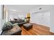 Living room with hardwood floors, sectional sofa and access to kitchen at 3777 Peachtree Ne Rd # 713, Atlanta, GA 30319