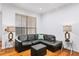Living room with hardwood floors and sectional leather sofa at 3777 Peachtree Ne Rd # 713, Atlanta, GA 30319