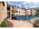 Community pool area with patio furniture and grill at 3777 Peachtree Ne Rd # 713, Atlanta, GA 30319