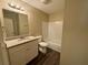 Clean bathroom with granite countertop, updated vanity, and tub at 5449 Martins Crossing Rd, Stone Mountain, GA 30088