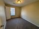 Bright bedroom featuring carpeted floors and large window at 5449 Martins Crossing Rd, Stone Mountain, GA 30088