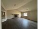 Spacious living room featuring a stone fireplace and wood-look flooring at 5449 Martins Crossing Rd, Stone Mountain, GA 30088