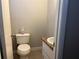 Clean and functional half bathroom with a pedestal sink at 10650 Panhandle Rd, Hampton, GA 30228