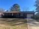 Brick ranch home with attached garage and driveway at 10650 Panhandle Rd, Hampton, GA 30228