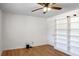 Bedroom with hardwood floors, built-in shelving and ceiling fan at 1468 Briarwood Ne Rd # 1307, Brookhaven, GA 30319