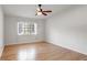 Hardwood floor bedroom with large window and ceiling fan at 1468 Briarwood Ne Rd # 1307, Brookhaven, GA 30319