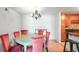 Dining room with light-colored table and red chairs at 1468 Briarwood Ne Rd # 1307, Brookhaven, GA 30319