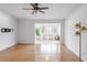 Living room with hardwood floors and sunroom access at 1468 Briarwood Ne Rd # 1307, Brookhaven, GA 30319