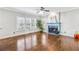 Living room with hardwood floors, fireplace, and plenty of natural light at 3377 Hunters Point Se Rd, Smyrna, GA 30082