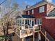 Large deck with screened porch and stairs at 6103 Governors Walk Dr, Canton, GA 30115