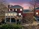 Two-story house with deck and sunroom addition at 6103 Governors Walk Dr, Canton, GA 30115
