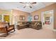 Finished basement recreation area with a sectional sofa and rocking chair at 6103 Governors Walk Dr, Canton, GA 30115