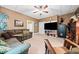 Finished basement with sectional sofa, large TV, and plenty of space at 6103 Governors Walk Dr, Canton, GA 30115
