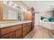 Double vanity bathroom with granite countertop at 6103 Governors Walk Dr, Canton, GA 30115