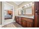 Double vanity bathroom with granite countertop at 6103 Governors Walk Dr, Canton, GA 30115