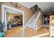 Hardwood floors, elegant staircase, and views of dining room at 6103 Governors Walk Dr, Canton, GA 30115