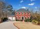 Two-story brick home with a two-car garage at 6103 Governors Walk Dr, Canton, GA 30115