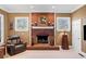 Brick fireplace is the focal point of this living room at 6103 Governors Walk Dr, Canton, GA 30115