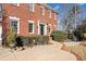 Brick home with manicured hedges and walkway at 6103 Governors Walk Dr, Canton, GA 30115