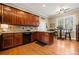Eat-in kitchen with hardwood floors and an island at 6103 Governors Walk Dr, Canton, GA 30115