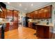 Spacious kitchen with granite countertops and dark wood cabinets at 6103 Governors Walk Dr, Canton, GA 30115