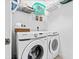 Laundry room with washer, dryer, and shelving at 6103 Governors Walk Dr, Canton, GA 30115