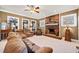 Spacious living room with a brick fireplace and hardwood floors at 6103 Governors Walk Dr, Canton, GA 30115
